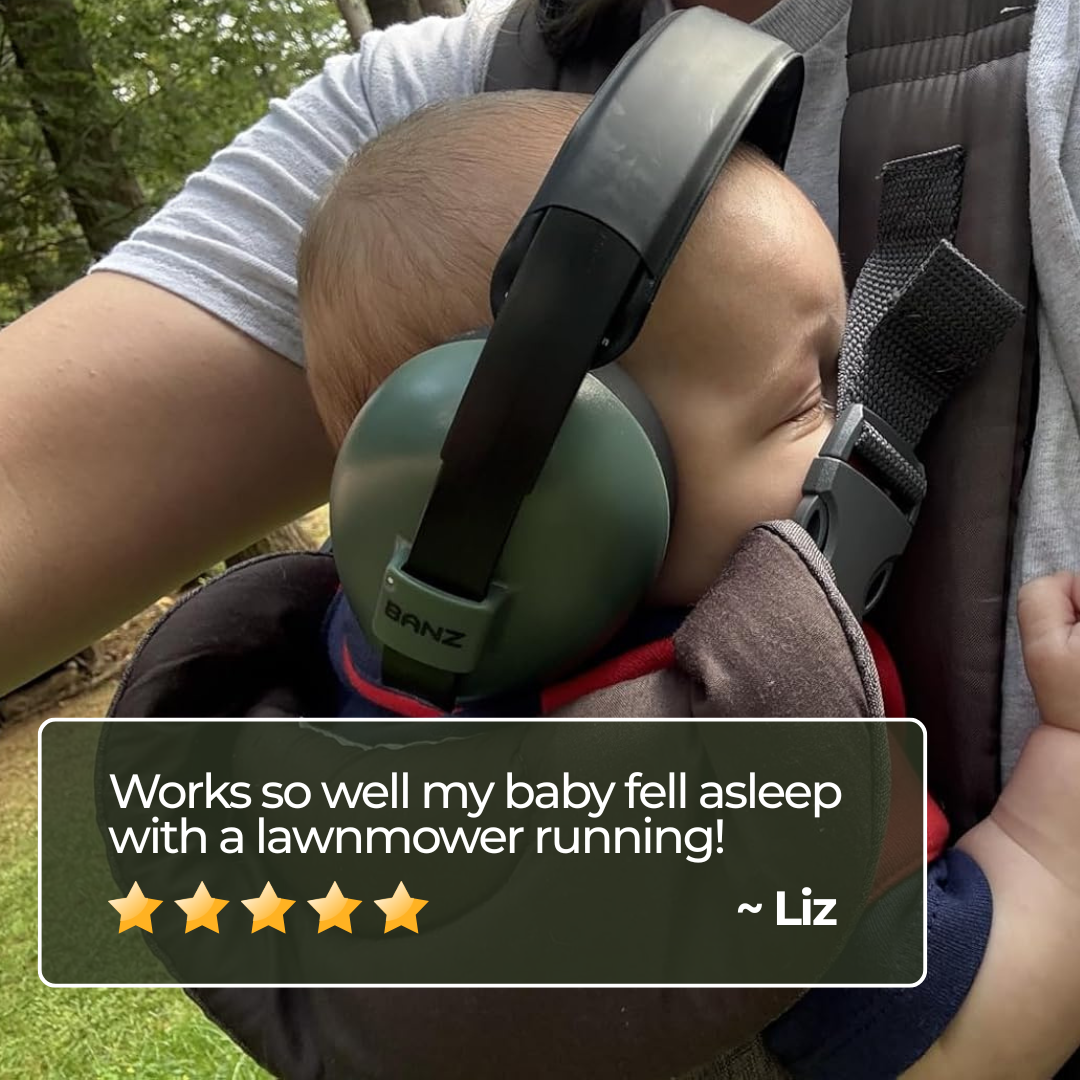 Baby wearing green ear protection headphones in a carrier with a text overlay from a user named Liz.